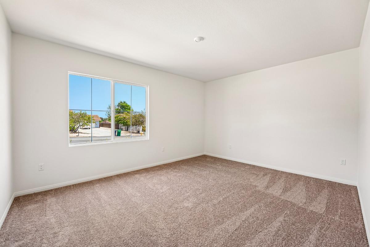 Representative builder view of a spacious secondary bedroom