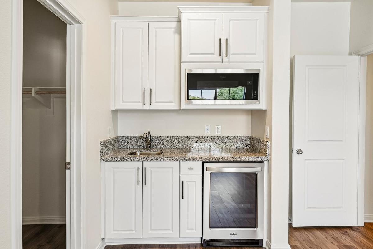 Representative builder view of the junior suite kitchenette and private-entry room
